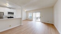 Located at 504 S La Fayette Park Place in Los Angeles, this one-bedroom, one-bathroom unit offers a well-organized single-floor layout with a clean, modern aesthetic throughout. Light wood flooring spans the entire unit, creating a bright and cohesive feel from room to room.

The open-concept living and kitchen area serves as the heart of the unit. The living room benefits from abundant natural light, with a large sliding glass door providing direct access to an outdoor balcony area. A ceiling fan adds comfort to the space. The kitchen is efficiently designed in a galley style, featuring white cabinetry, marble-style quartz countertops, a double-basin sink, and a full suite of stainless steel appliances including a gas range, microwave, refrigerator, and dishwasher.

The bedroom is a comfortable, well-proportioned room with a natural window that brings in additional daylight. A set of sliding mirrored closet doors provides ample storage. The textured ceiling and clean white walls carry throughout the bedroom, maintaining the unit's consistent design language.

The bathroom is straightforward and functional, featuring a full tub-shower combination with tiled walls and wood-tone flooring. The unit's neutral palette and updated finishes make it a versatile and move-in ready space in the heart of Los Angeles.