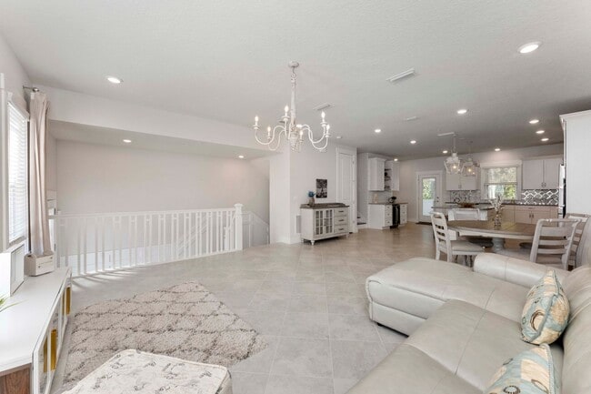 Building Photo - Introducing a captivating 3-story townhome...