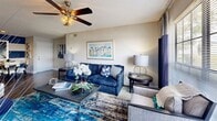 Located in Saint Petersburg, FL, this well-appointed 3-bedroom, 2-bathroom residence offers a thoughtfully designed single-floor layout. The open-concept living and dining area is bright and welcoming, featuring hardwood-style flooring, a ceiling fan with light fixture, and large windows that invite natural light and outdoor views. A bold accent wall with horizontal navy and white stripes adds a distinctive design touch to the dining space.

The galley-style kitchen is efficiently laid out with white cabinetry, dark granite-style countertops, black appliances, and a stainless steel sink — offering ample storage and functionality. It connects seamlessly to the dining area via a peninsula counter.

The primary bedroom is a comfortable retreat with plush carpet, a reach-in closet, and a window with natural light. An en-suite bathroom features white cabinetry, dark countertops, and a tub-shower combination. The additional bedrooms also feature carpet flooring and neutral tones. The second full bathroom mirrors the same clean aesthetic with white fixtures, built-in shelving, and a tub-shower combo. A hallway and closet round out the layout, providing practical storage throughout this efficiently designed Saint Petersburg home.