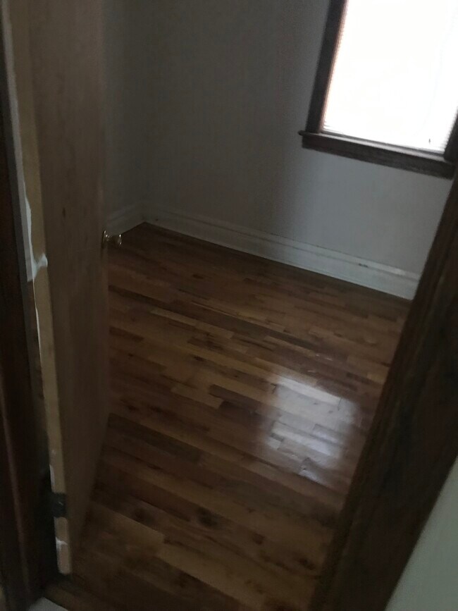 Bedroom and living room- wood floors - 2338 S Marshall Blvd