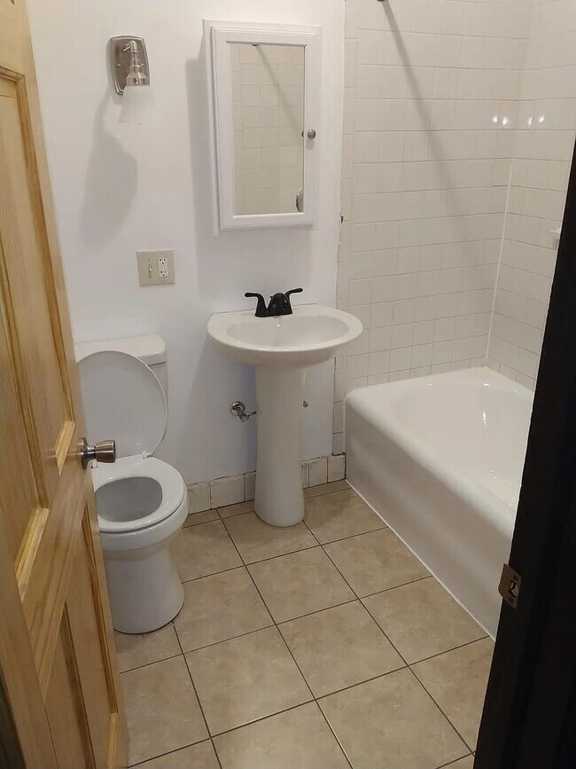 Building Photo - 6223 S Vernon Ave