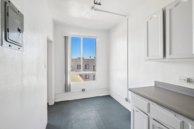 Union a kitchen with white cabinetry and a window - Westland @ Union