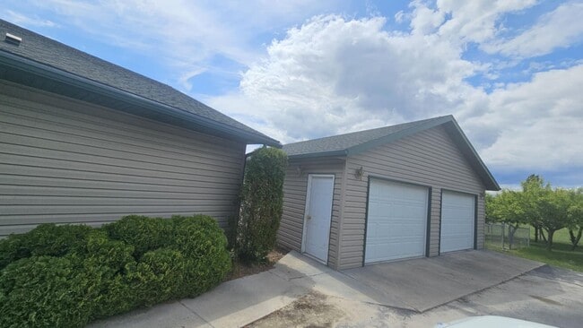 Building Photo - Out of town house with double garage and l...