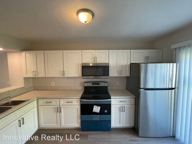 Building Photo - 2 br, 2 bath Condo - 3651 N. Goldenrod Rd....