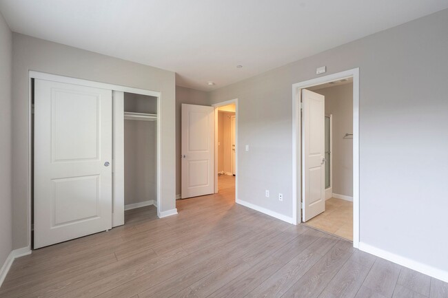 Building Photo - Luxurious 4-Bedroom End-Unit Condo with Al...