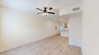 Located at 615 Tiny Town Rd in Clarksville, TN, this two-story, 2-bedroom, 3-bathroom home offers a clean, modern aesthetic across two thoughtfully arranged floors. The main level features an open-concept kitchen and living area finished with light luxury vinyl plank flooring throughout. The kitchen is a standout space, showcasing gray shaker-style cabinetry with matte black hardware, quartz countertops, a peninsula with pendant lighting, stainless steel appliances, and a black undermount sink — all bathed in natural light from multiple windows. The living area is accented by a ceiling fan and a welcoming front entry. The main level also includes a full bathroom with quartz vanity, an oval mirror, and a tub-shower combination. Upstairs, two comfortable bedrooms feature plush carpet flooring and ceiling fans, with the primary bedroom offering generous proportions. The upper level is completed by additional bathrooms and a dedicated laundry area. Throughout the home, neutral wall tones, crisp white trim, and consistent finishes create a bright, cohesive atmosphere well-suited for comfortable everyday living.