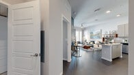 Located at 486 Centerpointe Circle in Altamonte Springs, Florida, this thoughtfully designed one-bedroom, one-bathroom residence offers a well-appointed single-floor layout that maximizes every inch of its comfortable footprint. Dark hardwood-style flooring flows throughout, providing a warm contrast to the contemporary neutral and blue-toned walls.

The open-concept kitchen and living area serves as the heart of the home. The kitchen is outfitted with light wood cabinetry extending to the ceiling, granite countertops, a subway tile backsplash, and a full suite of stainless steel appliances. A peninsula with bar seating transitions seamlessly into the dining and living areas, making the space ideal for entertaining.

The living room is bright and inviting, benefiting from large windows and a glass door that floods the space with natural light and provides access to an outdoor balcony. The accent wall in a deep slate blue adds a bold, modern touch.

The primary bedroom is generously sized, featuring deep teal walls, plush carpeting, and ample room for a full furniture arrangement. A dedicated closet provides practical storage. The bathroom includes a full tub-shower combination with white subway tile, a granite-topped vanity with wood-toned cabinetry, and tasteful finishes throughout.