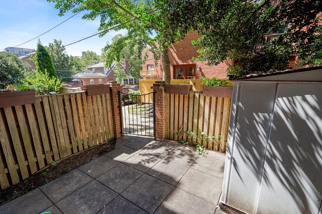 Gated patio with storage at right - 1140 N Taylor St