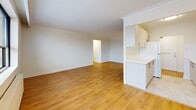 This well-designed 710 square foot apartment in Toronto offers a practical and contemporary living space. The unit features two bedrooms, including a primary bedroom of 170 square feet, providing ample space for rest and relaxation. The single-floor layout maximizes efficiency, with an open-concept design that seamlessly integrates the living room and kitchen areas.

Throughout the apartment, gleaming hardwood floors create a warm and inviting atmosphere, complemented by crisp white walls that enhance the sense of space and light. Large windows in the living area and bedrooms allow natural light to flood the interiors, offering pleasant views of the surrounding area.

The modern kitchen boasts sleek white cabinetry and updated appliances, making it both functional and aesthetically pleasing. The bathroom features a clean, minimalist design with a white vanity and a combination tub-shower unit.

Circular light fixtures provide even illumination throughout the space, while baseboard heating ensures comfort during colder months. Built-in closets in the bedrooms offer practical storage solutions. The apartment's layout, with its central hallway, ensures easy navigation between rooms.

Located at 75 42nd St in Toronto, this apartment combines urban convenience with a comfortable living environment, making it an ideal choice for those seeking a modern, low-maintenance home in the city.