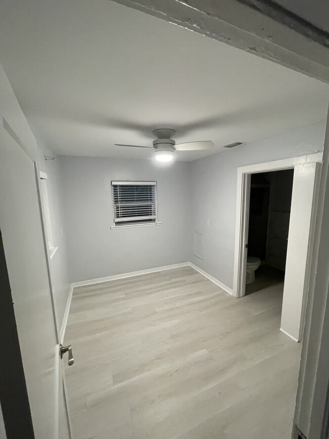 Bedroom 1, has closet, new floors, ceiling fans and blinds - 507 SE High School Ave