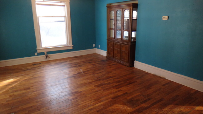 Living room has a beautiful china hutch included! - 1307 SW Mulvane St