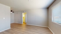 Located at 4625 Tinker Diagonal in Del City, Oklahoma, this single-floor unit offers a thoughtfully updated interior with a clean, modern aesthetic. The open living area is finished with light-toned luxury vinyl plank flooring that extends throughout the main living spaces, contributing to a bright and cohesive feel. A ceiling fan provides comfort, and the layout flows naturally into adjacent rooms.

The kitchen features white shaker-style cabinetry, a classic white subway tile backsplash, stainless steel appliances including an electric range, and a sink positioned along the perimeter — offering both functionality and a fresh, contemporary look.

The bedrooms are carpeted for comfort and each receive natural light through sizable windows fitted with horizontal blinds. The primary bedroom includes direct access to a dedicated bathroom as well as a closet, providing a practical and private retreat.

The bathrooms are a standout feature of this unit, showcasing full tub-and-shower combinations tiled floor-to-ceiling in crisp white subway tile, accented with matte black fixtures and hardware that add a striking, on-trend contrast. The vinyl plank flooring carries into the bathrooms, maintaining visual consistency throughout.

Overall, the space presents a clean, updated environment with modern finishes and a neutral palette well-suited for a variety of interior styles.
