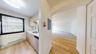 This 2-bedroom, 1-bathroom unit in Madison, WI offers a well-organized single-floor layout designed for comfortable everyday living. The combined kitchen and living area forms the heart of the home. The kitchen features contemporary light wood cabinetry, white quartz countertops, stainless steel appliances including a refrigerator, range, microwave, and dishwasher, plus light hardwood-style flooring and a window that brings in natural light. The living room transitions seamlessly from the kitchen, offering plush carpeting, a ceiling fan, a baseboard heater, and a sliding glass door that opens onto a private balcony with views of mature trees and the surrounding neighborhood. The spacious primary bedroom includes soft carpet, a ceiling fan, and abundant closet space with dual sliding bi-fold closet doors. The second bedroom mirrors this comfort with carpet, a ceiling fan, a window, and its own closet. The full bathroom is clean and functional, featuring a tub-shower combo with a white surround, patterned tile flooring, and brushed nickel fixtures. Throughout the unit, neutral tones and consistent finishes create a cohesive, move-in-ready atmosphere well-suited for residents seeking practical, comfortable living in Madison.