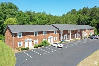 Resident Parking/Building Exterior - Morgan Place Apartments