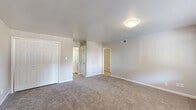 Located at 2050 Austell Rd SW in Marietta, GA, this single-floor home offers four bedrooms, two bathrooms, a kitchen, and a connecting hallway. The layout is practical and well-organized, making efficient use of its footprint.

The expansive primary bedroom features plush carpeting, multiple closets including a double-door closet and a louvered closet, and convenient access to adjoining rooms via the hallway. The additional bedrooms are similarly carpeted and include ceiling fans and standard closets, providing comfortable and functional living spaces.

The kitchen is a standout feature, boasting crisp white shaker-style cabinetry, granite-patterned countertops, a gas range, and wood-look flooring. A bright dining area adjacent to the kitchen benefits from a large window that fills the space with natural light and offers views of surrounding greenery.

The two bathrooms are clean and functional — one features a tiled tub-shower combination, while the other offers a tiled walk-in shower, both finished in white with chrome fixtures.

Throughout the home, neutral tones, white trim, and consistent finishes create a cohesive and move-in-ready aesthetic. The single-floor design ensures easy accessibility and a seamless flow between all living areas.