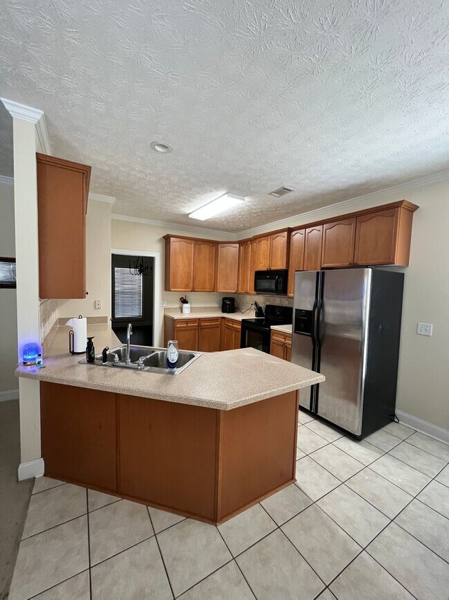 Foto del edificio - Gardens at Gatewood Townhome