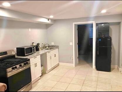 Full kitchen with apartment size fridge - 549 45th St NE