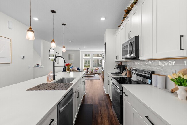 Building Photo - Upgraded 3BR/3.5BA Laureate Park Townhome | 2-Car Garage + EV Charging