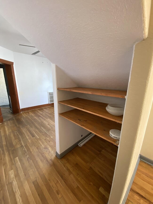 Shelving in hallway. - 2741 W 32nd Ave
