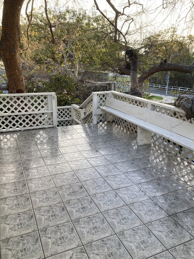 Seating area on front door deck - 150 Amalfi Dr