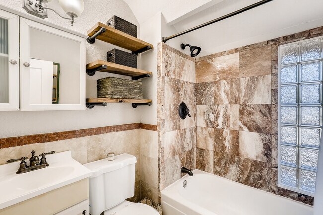 Tiled bathtub and shower in full bath upstairs - 4131 Vallejo St