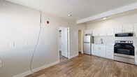 Located at 370 E Harmon Ave in Las Vegas, NV, this efficient one-bedroom, one-bathroom unit offers a well-organized single-floor layout designed to maximize every inch of available space. Wood-look flooring flows consistently throughout, lending a warm and cohesive aesthetic across all rooms.

The living area is bright and open, featuring a white entry door and a window that allows natural light to fill the space. The kitchen is efficiently designed and well-equipped, featuring white shaker-style cabinetry, light countertops, and a full suite of stainless steel appliances including a refrigerator, electric range, over-the-range microwave, and a single-basin sink — providing all the essentials for everyday cooking and meal prep.

The bedroom is a cozy, private retreat with a window overlooking the outdoors, bringing in natural light and a connection to the surrounding environment. A dedicated closet provides practical storage. The bathroom is clean and functional, outfitted with a white vanity with an integrated sink, a tub/shower combo with tiled surround, and a toilet — all finished in a crisp, neutral palette. The textured ceiling and neutral wall tones throughout contribute to a clean, move-in-ready atmosphere suited for comfortable urban living in the heart of Las Vegas.