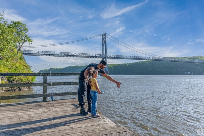 A father and his daughter enjoy fishing at Victor C. Waryas Park in Downtown Poughkeepsie.