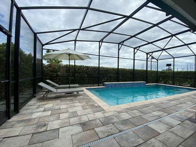 Foto del edificio - Spacious 5 Bedroom Pool Home with In-Law Suite in Lake Nona’s Coveted Storey Park!