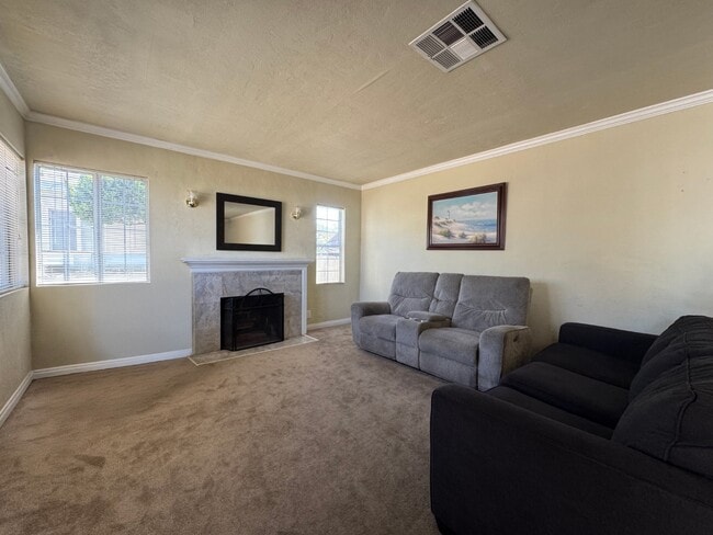 Living Room w/ Fireplace - 11050 Keswick St
