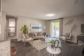 Located at 3900 Arcadia Lane in Henrico, Virginia, this single-floor residence offers a well-designed layout with a cohesive, modern aesthetic throughout. The living area is spacious and inviting, finished with wood-style flooring and neutral-toned walls that create a warm, versatile backdrop. A sliding glass door floods the room with natural light and provides outdoor access, while an open sightline connects seamlessly to the kitchen and dining area.

The kitchen is equipped with stainless steel appliances, white shaker-style cabinetry, granite countertops, and a classic subway tile backsplash. A breakfast bar with bar seating adds both function and style to the space.

The bedrooms are generously sized, each featuring wood-style flooring, large windows with ample natural light, and well-proportioned closets. The primary bedroom benefits from direct access to an en-suite bathroom, which includes a single vanity with white cabinetry, a large mirror, and a shower-tub combination. A second full bathroom mirrors this clean, functional design.

Throughout the residence, consistent finishes — including neutral paint tones, modern fixtures, and durable flooring — create a unified and polished interior. The overall ambiance is bright, comfortable, and move-in ready.
