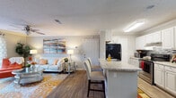 Located at 6350 Oakley Rd in Union City, Georgia, this single-floor residence offers a well-designed, open-concept layout that seamlessly connects the main living spaces. The living room is bright and welcoming, featuring wood-style flooring, crown molding, a ceiling fan, and a large sliding glass door that fills the room with natural light and provides access to a private outdoor patio. The kitchen is outfitted with white cabinetry, granite-style countertops, stainless steel appliances, a mosaic tile backsplash, and a peninsula with bar seating — ideal for casual dining or entertaining. Adjacent to the kitchen, a dedicated dining area features crown molding and an elegant pendant light fixture. The primary bedroom offers a comfortable, carpeted retreat, while a second bedroom provides ample space and natural light, complete with carpeting and a window. The bathroom is finished with wood-style flooring and a shower-tub combination. Throughout the home, neutral gray tones, crown molding, and consistent flooring create a cohesive and polished aesthetic. The thoughtful floor plan and abundance of natural light make this a functional and inviting single-floor home.