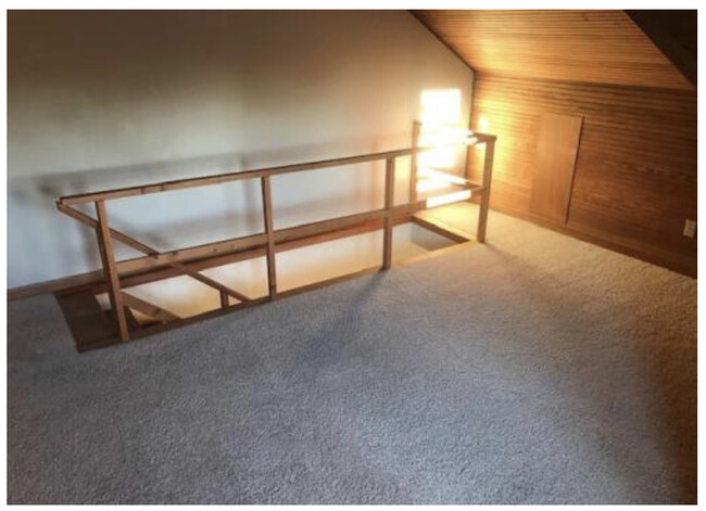 Carpeted loft bedroom - 801 S Main St