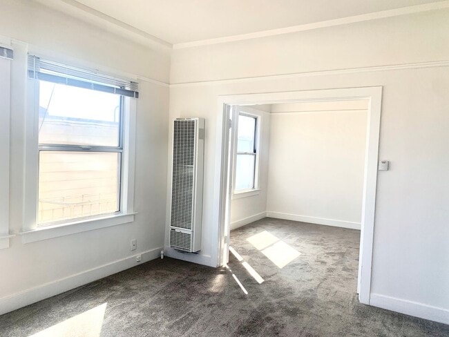 Building Photo - Exceptional Location! Sun Filled Top Floor...