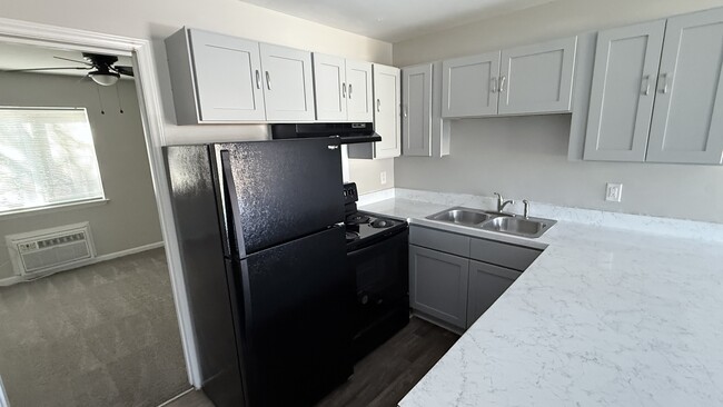 Kitchen With Breakfast Bar - Guilford Place Apartments.