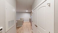 Located at 1547 Caprine Ct in Rock Hill, South Carolina, this single-story, 3-bedroom, 2-bathroom home offers a well-organized and functional layout designed for comfortable everyday living. Light wood-tone flooring runs consistently throughout, creating a bright and cohesive feel across every room.

The kitchen is a standout feature, offering ample cabinetry in a warm wood finish, granite-style countertops, a double-basin sink set within a peninsula island, and a full suite of stainless steel appliances including a range, microwave, and refrigerator. The kitchen opens directly into the living area, which is illuminated by natural light from a large window and sliding door, and fitted with a ceiling fan overhead.

The primary bedroom is generously sized and includes a ceiling fan and access to adjoining spaces. Additional bedrooms feature the same light flooring, neutral wall tones, and arched-panel closet doors. The bathrooms are equipped with granite-style vanity tops, wood-framed cabinetry, and windows that bring in natural light. A hallway connects the bedroom wing and provides additional storage via a dedicated closet. The home's neutral color palette and clean finishes create a move-in-ready environment throughout.