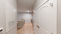 Located at 1547 Caprine Ct in Rock Hill, South Carolina, this single-story, 3-bedroom, 2-bathroom home offers a well-organized and functional layout designed for comfortable everyday living. Light wood-tone flooring runs consistently throughout, creating a bright and cohesive feel across every room.

The kitchen is a standout feature, offering ample cabinetry in a warm wood finish, granite-style countertops, a double-basin sink set within a peninsula island, and a full suite of stainless steel appliances including a range, microwave, and refrigerator. The kitchen opens directly into the living area, which is illuminated by natural light from a large window and sliding door, and fitted with a ceiling fan overhead.

The primary bedroom is generously sized and includes a ceiling fan and access to adjoining spaces. Additional bedrooms feature the same light flooring, neutral wall tones, and arched-panel closet doors. The bathrooms are equipped with granite-style vanity tops, wood-framed cabinetry, and windows that bring in natural light. A hallway connects the bedroom wing and provides additional storage via a dedicated closet. The home's neutral color palette and clean finishes create a move-in-ready environment throughout.