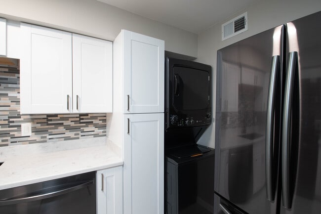 Large pantry, new stacked W/D tucked behind new fridge w/ ice maker - 5305 Fleetwood Oaks Ave