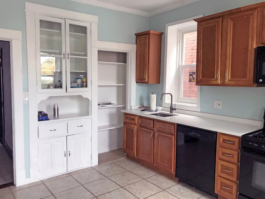 Large built-in pantry and hutch. Quartz countertops with under-mount sink. - 4125 Juniata St