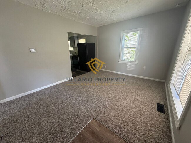 Building Photo - Charming 3-Bedroom Stone Bungalow with 2-Car Detached Garage & Fenced Yard, Available NOW!