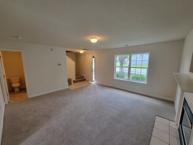 Ample light and inviting space in the living room. - 6903 Seney Dr