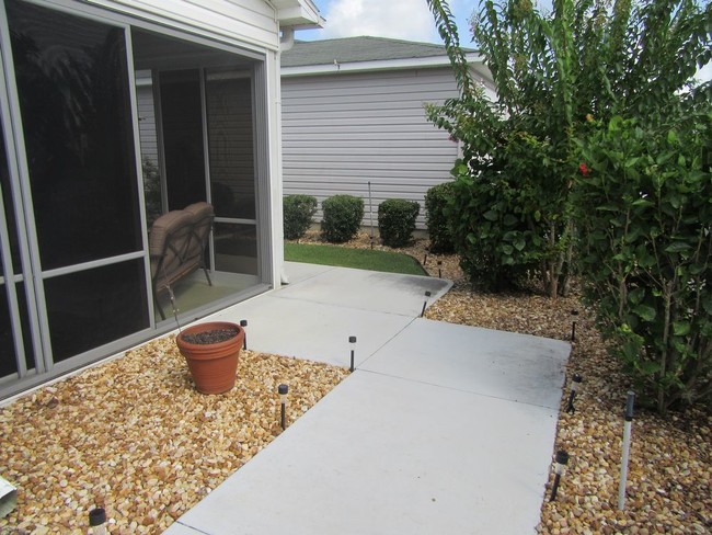 Building Photo - Updated Patio Villa with a Golf Cart