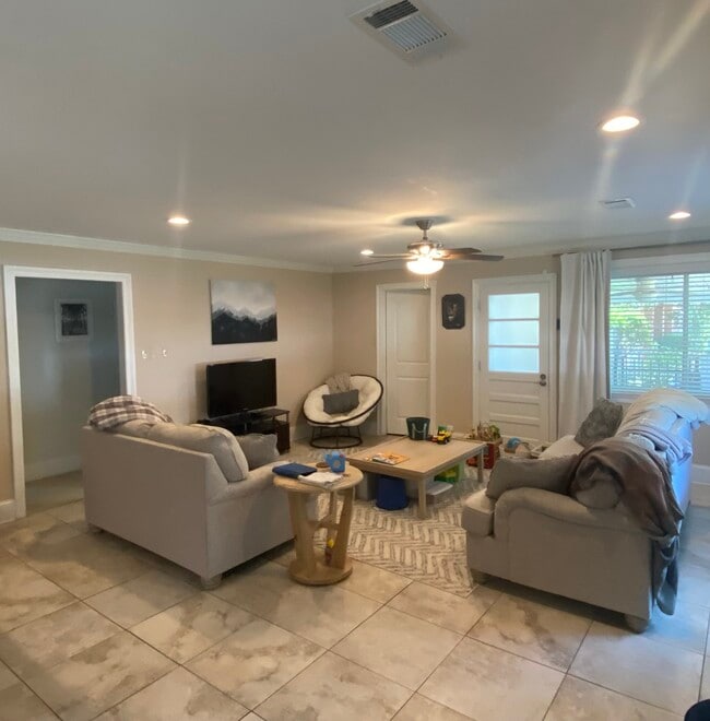Spacious living room open to kitchen with tons of natural lighting - 5012 Antonini Dr