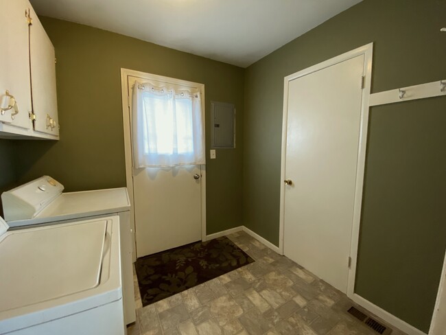 Side door entryway/mud room with washer/dryer - 618 Clayton Ave NW