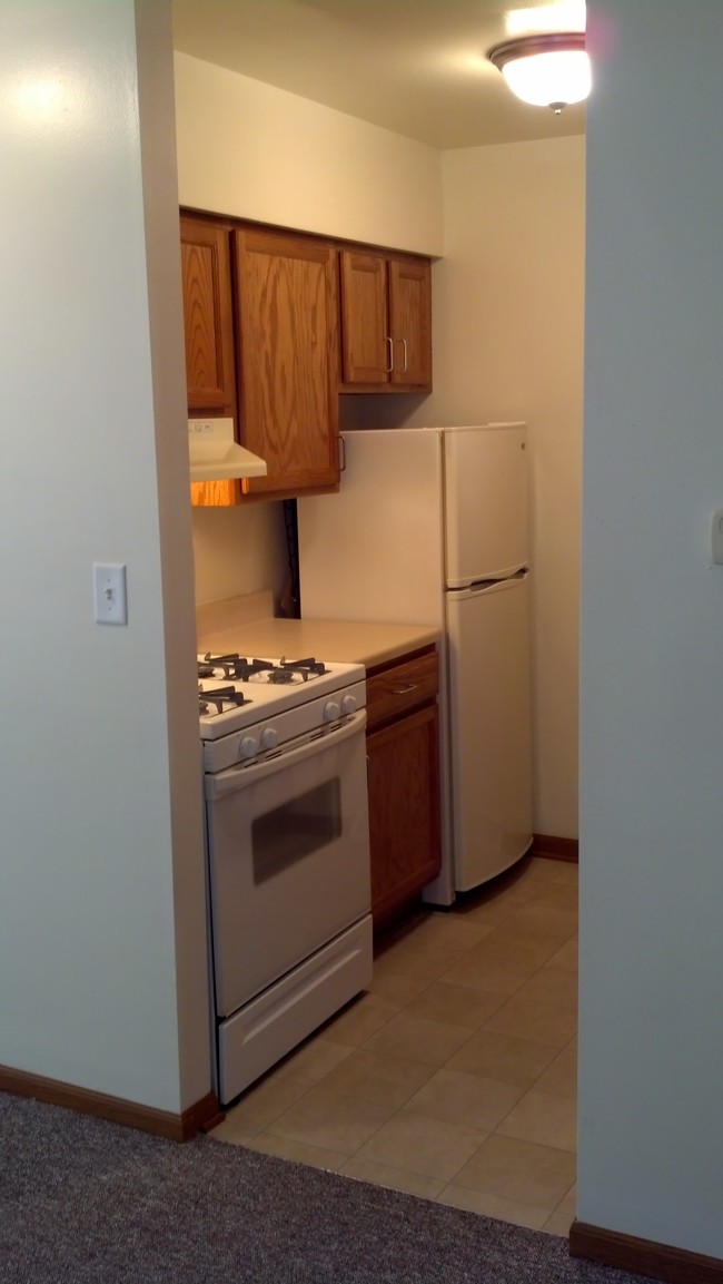 The kitchen inside a Meredith Homes one bedroom apartment restricted for people age 55+. - Meredith Homes