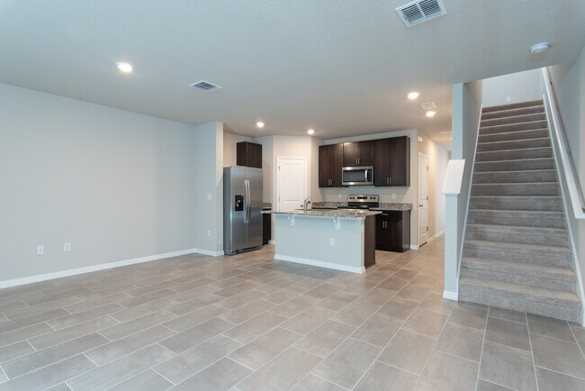 Stairs and Kitchen - 2715 Scarlet Bay Pl