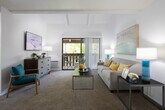 Located at 15123 Brookhurst St in Westminster, California, this single-story residence offers a bright and thoughtfully designed layout. The living room is a standout space, characterized by striking vaulted ceilings with exposed white beams that lend an airy, open feel. Large sliding glass doors lead directly to a private balcony, bringing in abundant natural light and views of surrounding greenery. The living area flows seamlessly into a dedicated dining nook, which features a ceiling fan, vertical blinds, and a window that further enhances the sense of openness.

The galley-style kitchen is efficiently designed with white cabinetry, recessed lighting, a double-basin sink, and wood-look flooring, providing ample counter space and storage. Two well-proportioned bedrooms are carpeted for comfort, each with windows that invite natural light and views of the outdoors. The bedrooms offer generous closet and storage options.

The bathroom is cleanly appointed with white cabinetry, a granite-style countertop, a large vanity mirror, and a tall storage tower, all complemented by wood-look flooring. Throughout the residence, a cohesive neutral palette with warm accent tones creates a welcoming and functional atmosphere suited to everyday living in the heart of Westminster, CA.