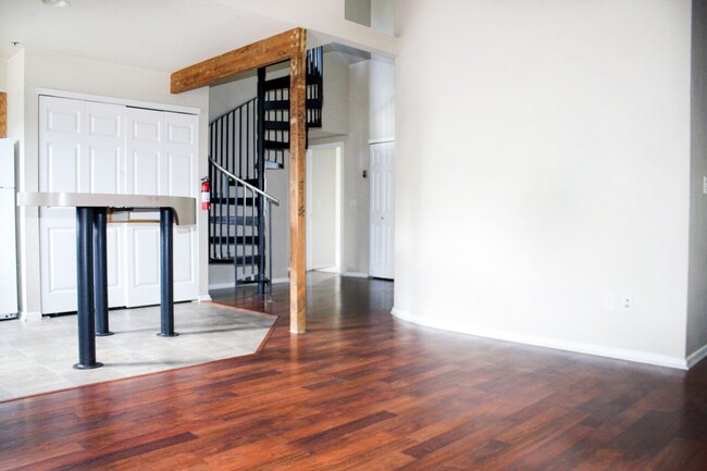 Upper loft with spiral staircase - Campus West Lofts on City Park