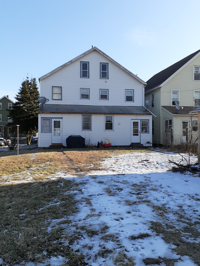 Rear entrance with yard - left - 223 Iron St