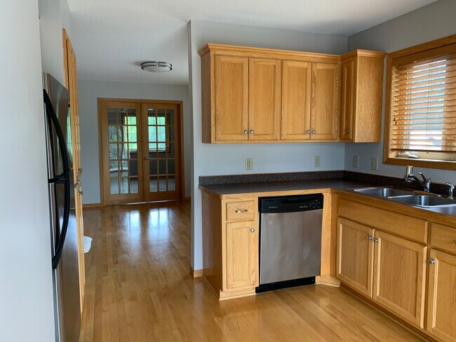 Kitchen connecting to dining area - 4347 Fremont Ave N