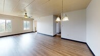 Located at 1170 Bower Hill Rd in Pittsburgh, PA, this two-bedroom, two-bathroom residence offers a well-organized single-floor layout designed for comfortable living. The open living and dining area features wood-style hardwood flooring that flows throughout, complemented by a classic chandelier and ceiling fan. Natural light filters in through multiple windows, creating a bright and welcoming atmosphere throughout the space.

The galley-style kitchen is efficiently designed with warm wood cabinetry, gold-toned hardware, a stainless steel sink, and white appliances including an electric range and refrigerator. The kitchen connects seamlessly to the main living areas via a hallway.

Both bedrooms are generously sized and carpeted for comfort, each equipped with ceiling fans and ample natural light from large windows. The spacious primary bedroom features double doors and a bright window with outdoor views. The second bedroom includes a built-in closet with louvered bifold doors.

The two bathrooms offer practical layouts with wood-style flooring. One features a full vanity with warm wood cabinetry, a large mirror, and generous counter space, while the second provides a shower-tub combination with clean white fixtures. Two hallways provide smooth connectivity between the living spaces, completing this well-appointed and functional home.